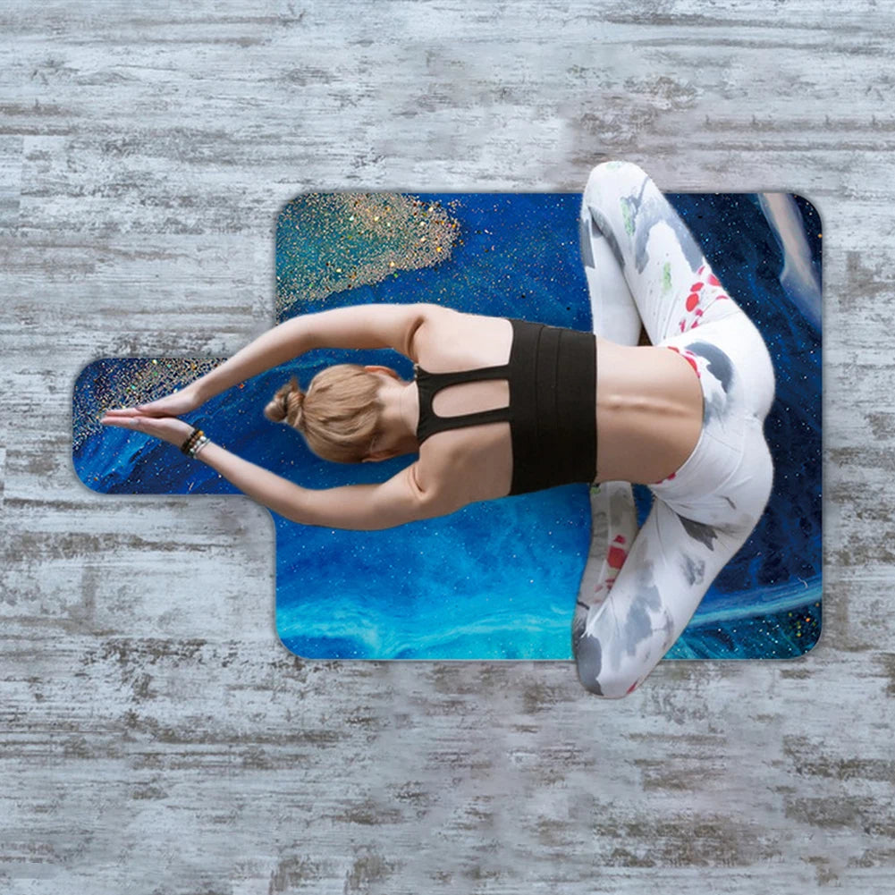 Non-slip suede Pilates mat in Blue Mirage pattern, woman practising yoga pose, top view